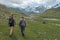 Female tourist walking through mountainous landscape and scenery on a popular tourist hike near Bokonbayevo, Kyrgyzstan