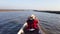 Female tourists take a longtail boat for a tour around Thale Noi, Phatthalung Province, Thailand