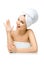 Female with towel on head shows cream smiley on palm