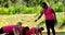 Female trainer instructing women while exercising during obstacle course