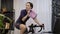 Female is training on indoor cycling trainer. Woman is cycling on stationary bike