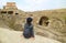 Female Traveler Admiring the Uplistsikhe Cave City Ruins, Located Near Gori Town in Shida Kartli Region of Georgia