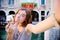 Female traveler making selfie photo with traditional italian ice cream in Venice