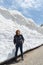 Female traveler and snow wall at japan alps tateyama kurobe alpine