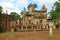 Female Traveler Taking Pictures in Front of the Library Ruins of Sdok Kok Thom Ancient Khmer Temple, Sa Kaeo Province, Thailand