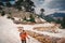 Female traveler walking down the snowy mountain in Turkey