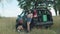 Female travelers checking out flat tyre on car