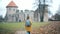 Female traveller walks toward a castle.