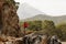 Female trekker stands on hills in Turkey