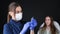 Female trichologist doctor in blue gloves prepares to inject a patient. Modern dermatological clinic.