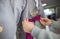 A female tying a ribbon on a korean traditional dress.