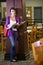 Female university student standing in library