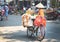 Female vendor on bicycle in a market of Ho Chi Minh city, Vietnam