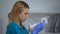 Female vet examining rabbit fur and stomach, complete pet physical checkup