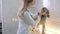 A female veterinarian examines the dog\'s eyes at the clinic.