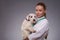 Female veterinarian examines little dog