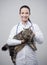 Female veterinarian holding a beautiful cat