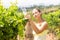 Female vintner holding wine glass