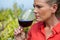 Female vintner smelling glass of wine