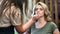 Female visagiste applying lipstick to woman during makeup. Medium close up shot on 4k RED camera