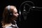 Female vocal recording. Young girl with microphone and headphones in recording studio. Recording of vocal, blogger, reading text,