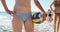 Female volleyball player holding volleyball at beach 4k