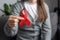 Female volunteer keep AIDS HIV disease awareness, healthcare, medicine concept. Close up of young woman sit on sofa holding small