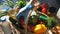 A female volunteer puts food in a basket for further delivery to elderly people in quarantine.