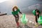 Female volunteers clean beach from garbage