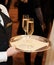 Female waiter with champagne flutes