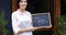 Female waiter standing with open sign board 4k