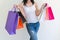 Female walks hands holding shopping bags in the mall