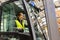 Female warehouse worker driving forklift. Warehouse worker preparing products for shipmennt, delivery, checking stock in