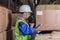 Female warehouse worker using tablet pc