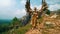 a female warrior in a golden costume and wings standing on a rocky mountain against