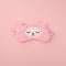 Female wearing cute kawaii sleeping band pink lama, trendy soft pastel pink on empty background. Top view Soft comfortable