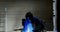 Female welder using blowing torch on a rod 4k