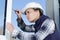 female window fitter using screwdriver