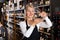 Female winemaker checking wine in store