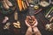 Female woman hands holding jerusalem artichokes or earth pear vegetables on rustic kitchen table with vegetarian cooking ingredien