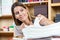 Female Worker Analyzing Papers In Shop