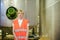 Female worker on beer factory. portrait woman in robe, standing on background line Food production, Inspection management control