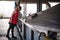 Female worker on beer factory. portrait woman in robe, standing on background line Food production, Inspection management control