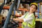 Female worker driving a forklift moving goods