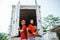 female worker holding clipboard with delivery man closing container door