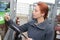 Female worker inspecting gas tanks