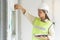 Female worker occupation. Woman inspector / architect checking interior material process in house reconstruction project