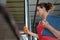 Female worker operating controls roller shutter door