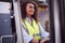 Female Worker Operating Fork Lift Truck At Freight Haulage Business