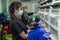 Female Worker with protective face mask and maintaining social distancing while working in Embroidery Textile Garment